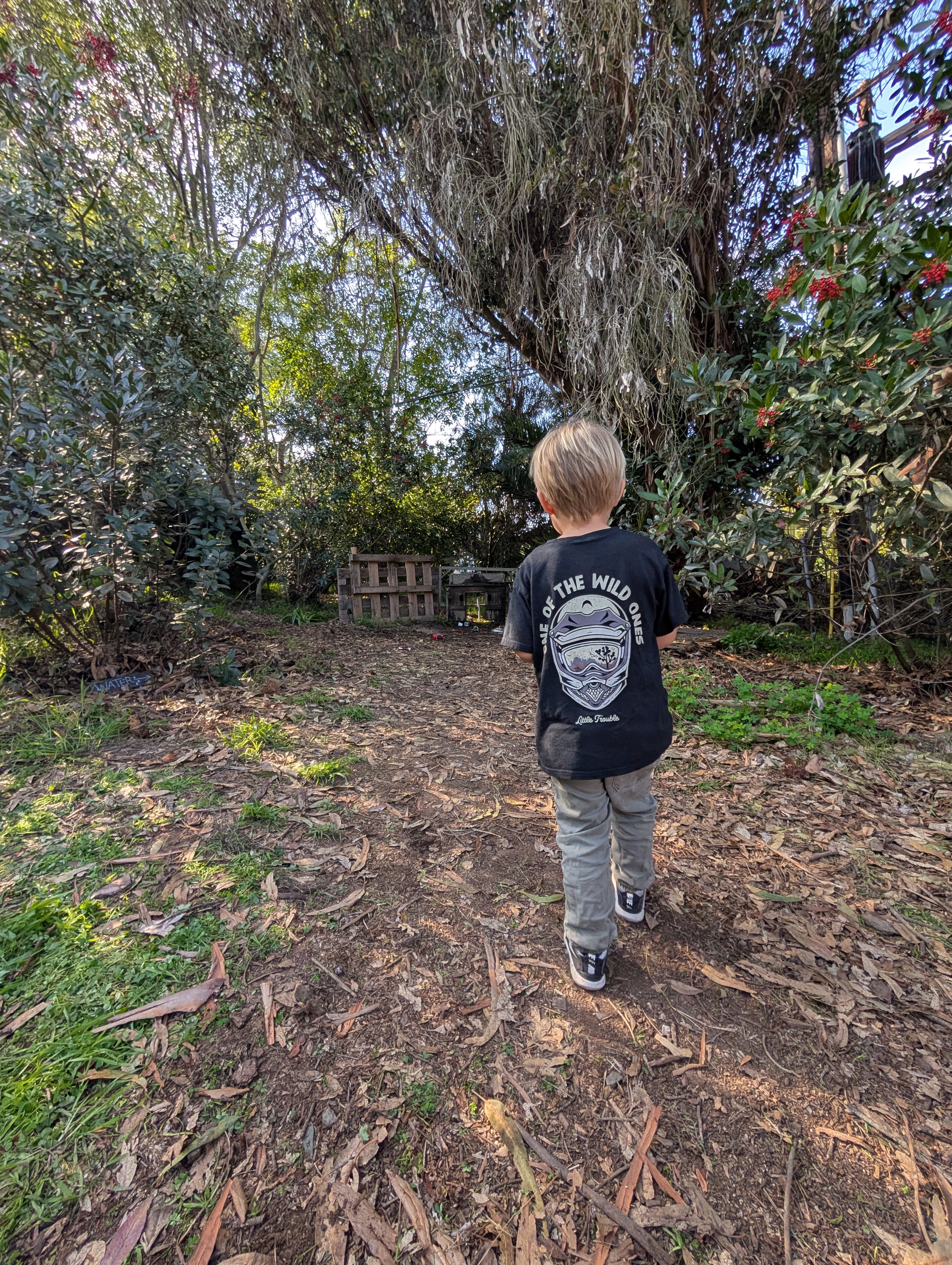 Child exploring outdoor summer camp activities at Valmonte Farm in Palos Verdes