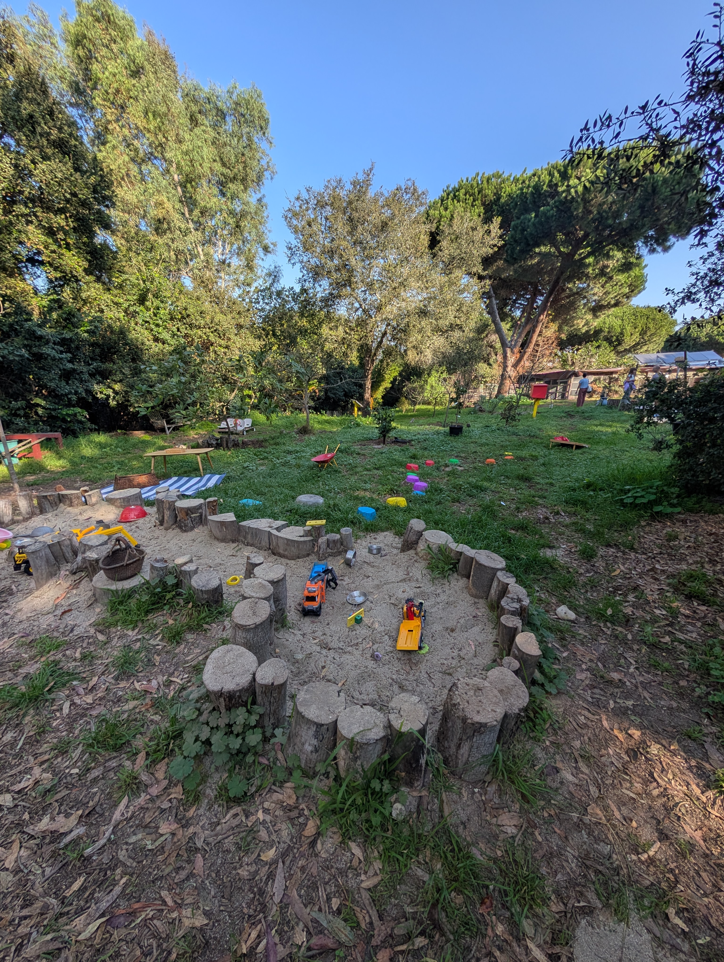 Construction sandbox and outdoor play area at Valmonte Farm